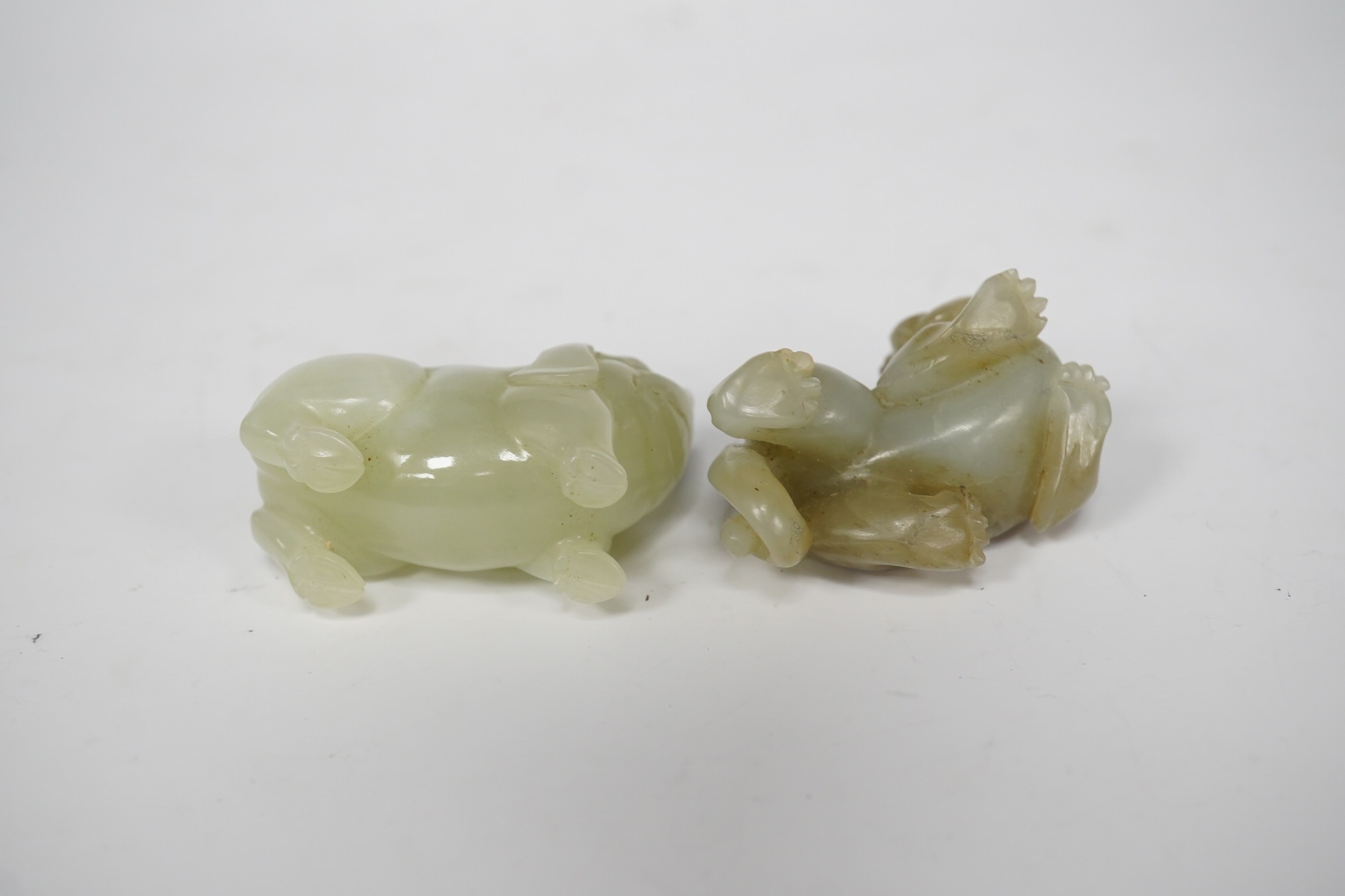 Two Chinese jade figures of animals including a pig, largest 5.5cm wide (2). Condition - good